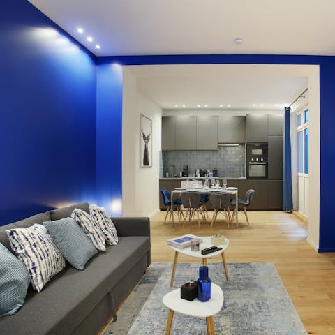 Unwind in the blue-hued living area after exploring Paris
