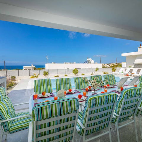 Tuck into sunset dinners while gazing at sea views from the alfresco dining set