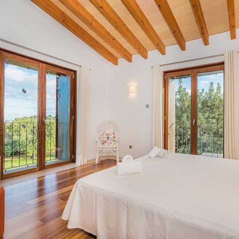 Admire expansive views from the Juliet balconies in the bedroom