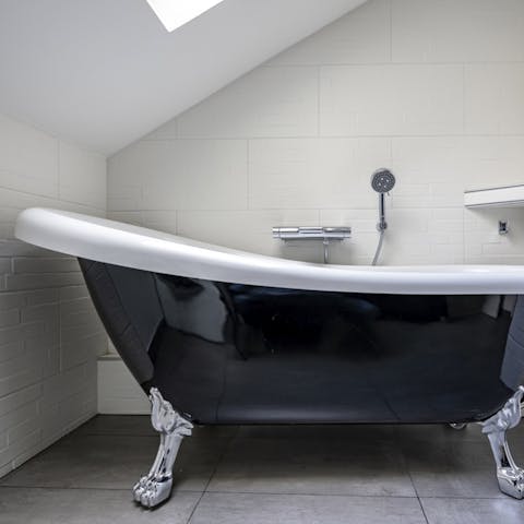 Soak in the claw-foot tub after a busy day of sightseeing