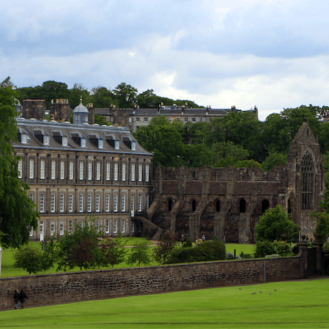 Visit the Palace of Holyrood and its ancient abbey, twelve minutes away