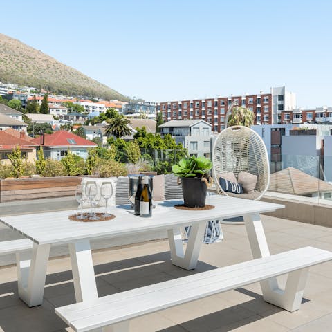 Share a bottle of wine and watch the sun set on the terrace