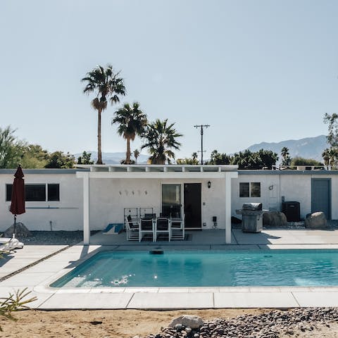 Relax in the sparkling pool after wandering the  luxury boutiques of Palm Springs 