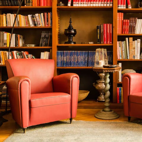 Pull a book from the shelves and get comfortable in the leather armchair