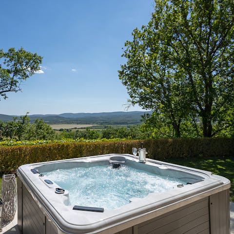 Soak in verdant views while unwinding in the hot tub