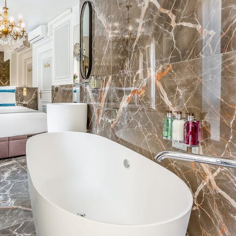 Treat yourself to a relaxing soak in the master bedroom's freestanding tub