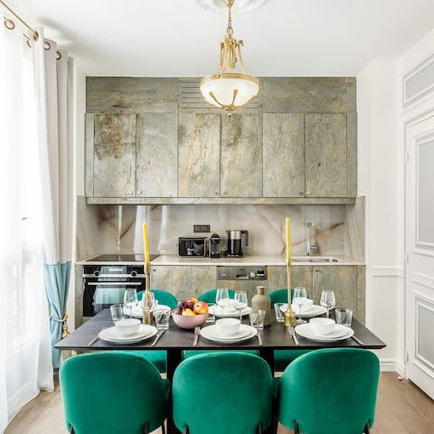 Sit down to an elegant meal in the marble-clad kitchen area