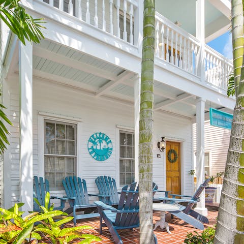 Bask under the shady porch of this classic wooden home