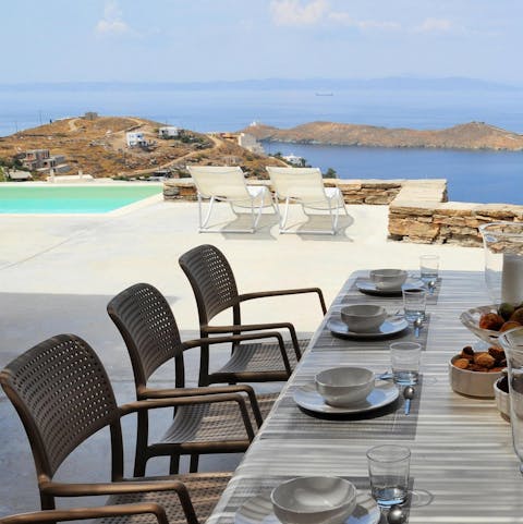 Dine alfresco on Greek cuisine overlooking the pool and sea