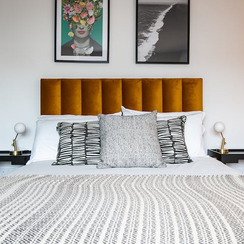 Sleep sound in the plush bed with the velvet headboard