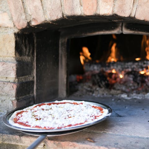 Cook up a homemade margherita in the pizza oven