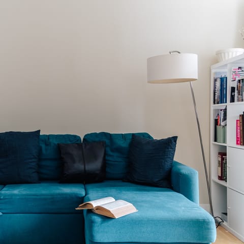 Pluck a book from the shelves and curl up on the comfortable L-shaped couch