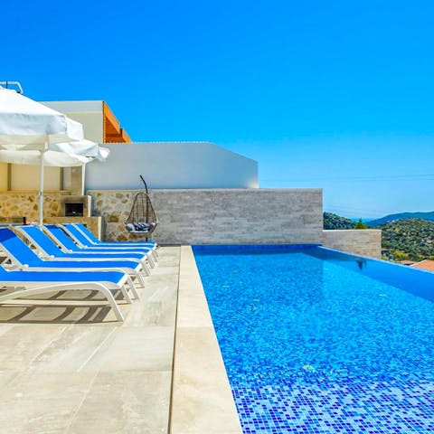 Alternate between the private infinity pool and the sun loungers