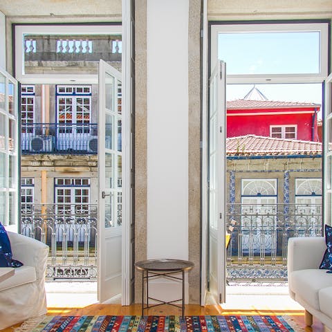 Bask in the light flowing through the living room's scenic French doors