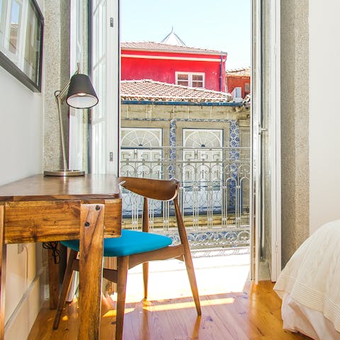 Catch up on work at the main bedroom's window-side desk space