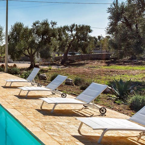 Chill out on the poolside sun loungers after a day of discovering Puglia