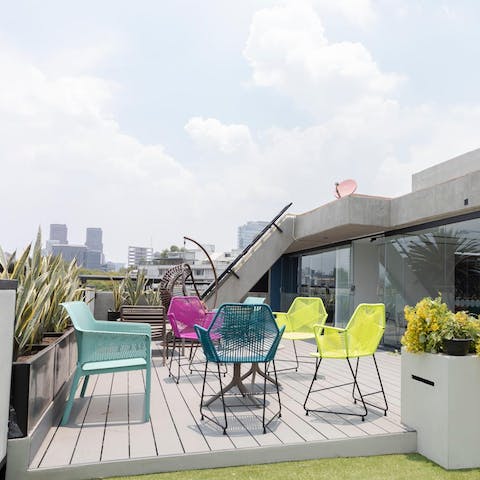 Chat with friends and soak up the sunshine on the shared terrace