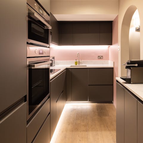 Cook in the sleek pink kitchen
