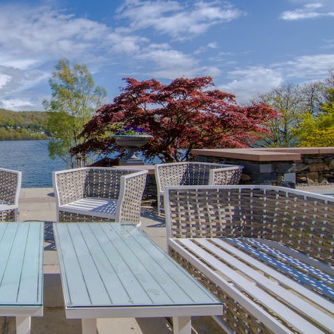 Sip sundowners on the wicker patio furniture