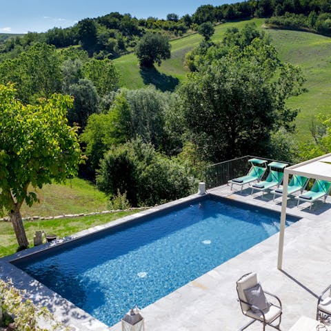 Spend afternoons taking col dips in the pool while admiring the green hills of Emilia-Romagna around you 