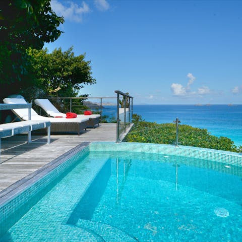 Admire the sprawling ocean views from the infinity pool
