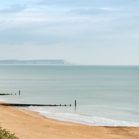 Explore Dorset's famous coast, including Eweleaze Beach, a twelve-minute drive away