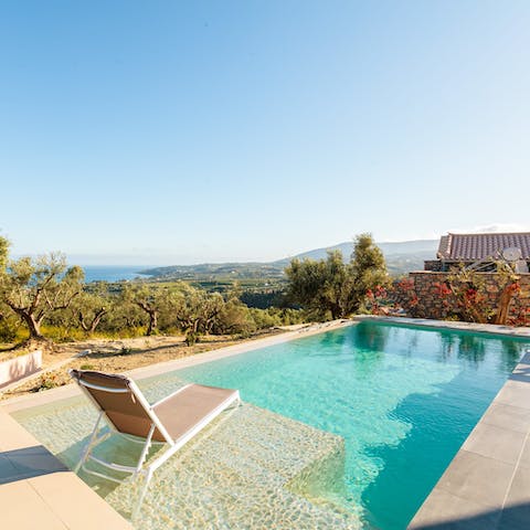 Take a refreshing dip in the outdoor pool, with views over the mountains