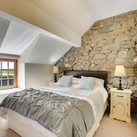 Get a restful night's sleep in the cosy bedroom with exposed stone walls