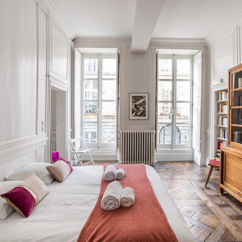 Wake up to Rennes views from the main bedroom's beautiful French windows