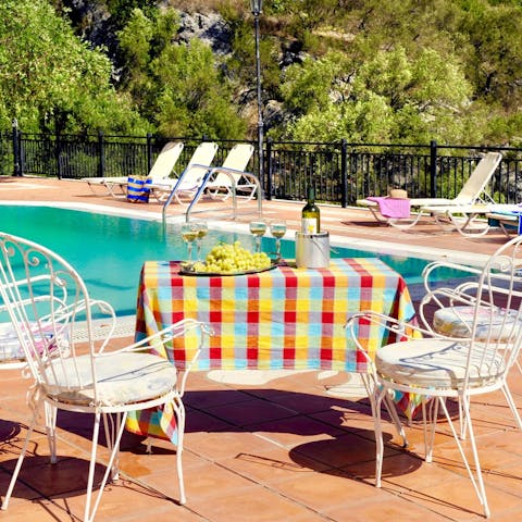 Soak up the island sun and share a bottle of wine on the pool deck