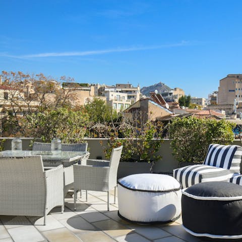 Kick back and enjoy a cool drink on the shared rooftop terrace