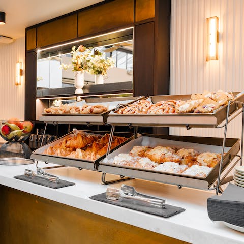 Enjoy the complimentary breakfast provided in the communal lobby's conservatory