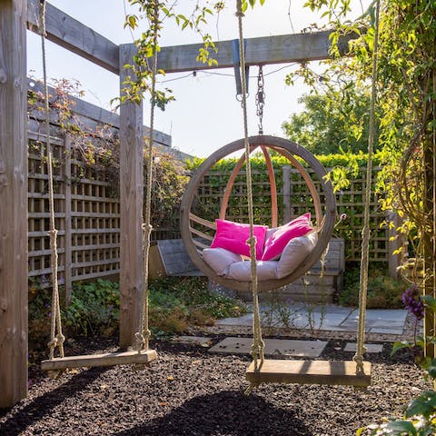 Have fun on the swings in the garden – there's even one for big kids