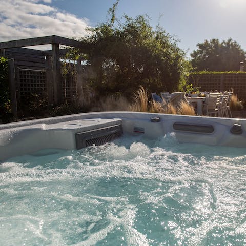 Relax in the hot tub after spending the day at the beach