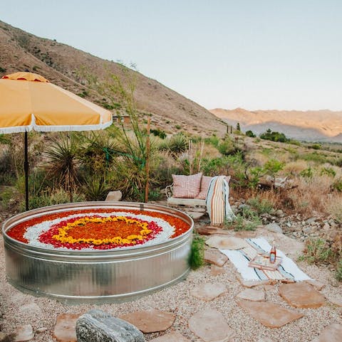 Take in breathtaking views of the desert from the outdoor tub