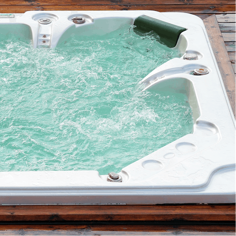 Treat yourself to a relaxing soak in the private hot tub