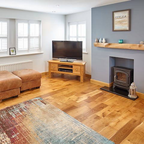 Spend cosy evenings relaxing in the living room with the gas-burning fireplace warming you up