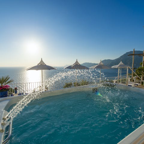 Relax with the pool's whirlpool jets – it's the place to be at sunset