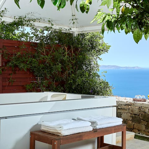 Unwind in the soothing bubbles of the hot tub