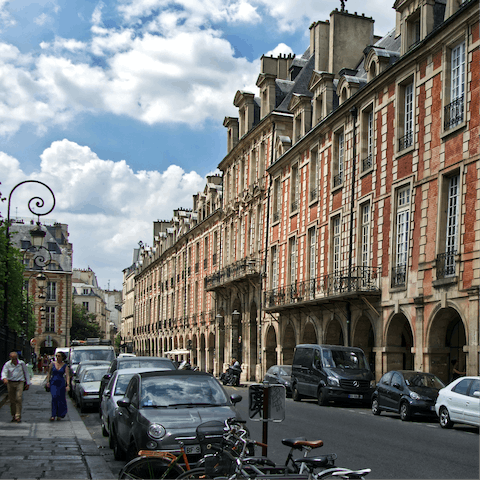 Stroll around the Place des Vosges, Paris' oldest planned square, a fifteen-minute walk away