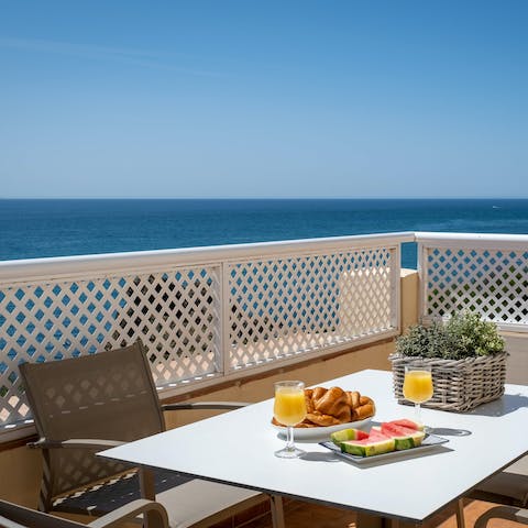 Enjoy pastries on the private balcony as you drink in the sea views