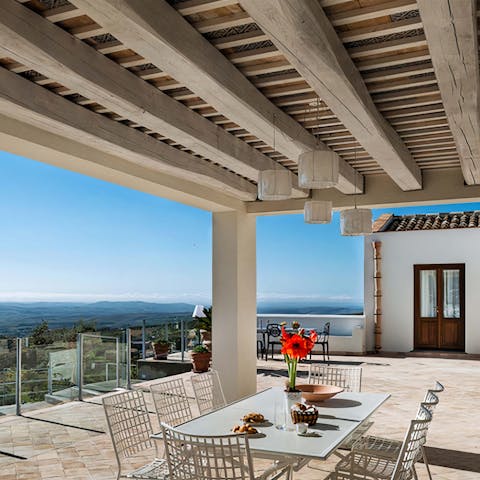 Dine alfresco under the pergola, perfect for outdoor itinerary planning