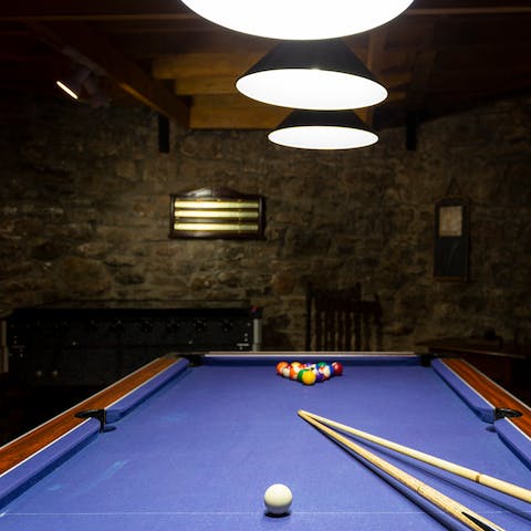 Play the night away at the pool table