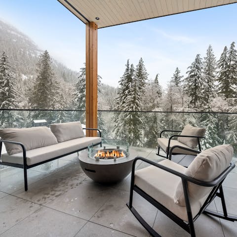 Drink in the mountain views as you relax around the firepit