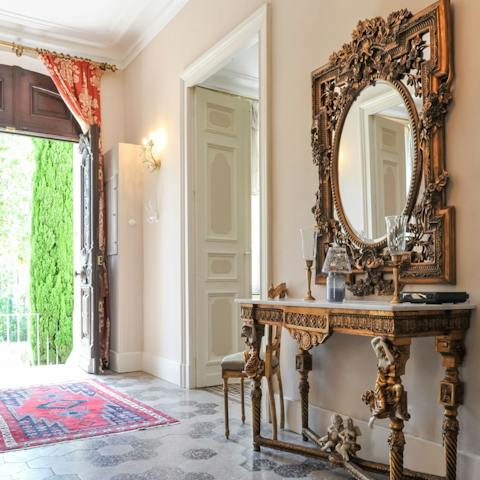 Admire the gorgeous collection of antique furniture throughout the house