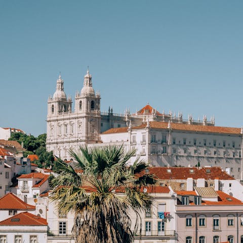 Explore the old-town district of Alfama, a ten-minute walk away
