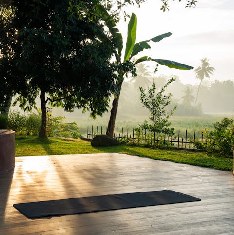 Start your day with a yoga session on the terrace overlooking the rice fields 