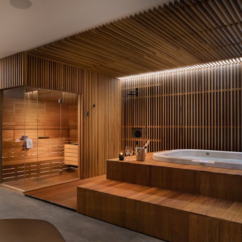 Unwind in the basement spa with sauna and hot tub