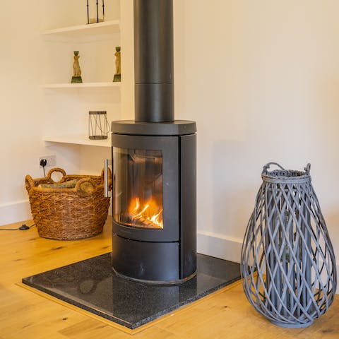 Cosy up by the wood burner on chilly evenings