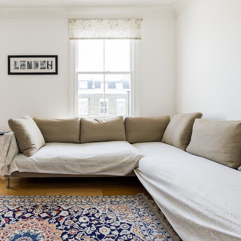 Get cosy on the L-shaped sofa for a quick nap after a long day of exploring the city